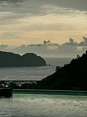 a view of a body of water with mountains and the ocean at Casa Mar CR in Herradura