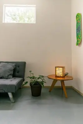 a living room with a couch and a table at Casa MONO in Santa Teresa Beach