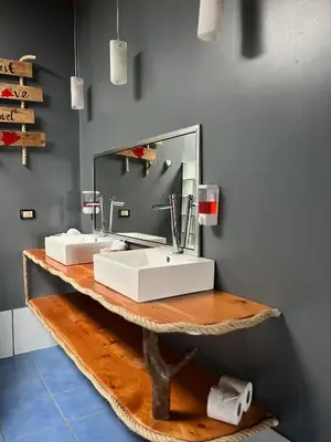 a bathroom with two sinks and a mirror at Monteverde Guesthouse in Monteverde Costa Rica