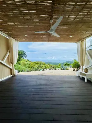 an open hallway with a view of a beach at CASA AYLA A - stunning 5BR Ocean view house & infinity pool in Flamingo in Playa Flamingo