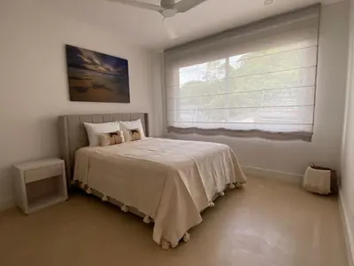 a bedroom with a bed and a large window at CASA AYLA A - stunning 5BR Ocean view house & infinity pool in Flamingo in Playa Flamingo