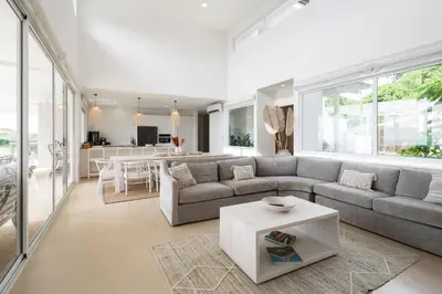 a living room with a couch and a table at CASA AYLA A - stunning 5BR Ocean view house & infinity pool in Flamingo in Playa Flamingo