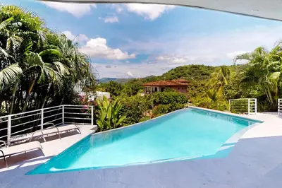 a swimming pool in a villa with a view at Casa Nalifos in Playa Flamingo