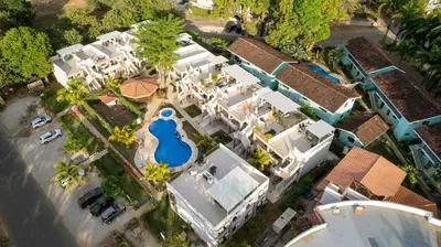 an overhead view of a house with a swimming pool at Coco Boho Beach Condo in Coco