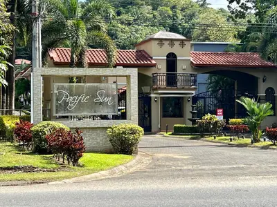 a house with a sign in front of it at Spacious Penthouse with pool & Jungle Views in La Mona