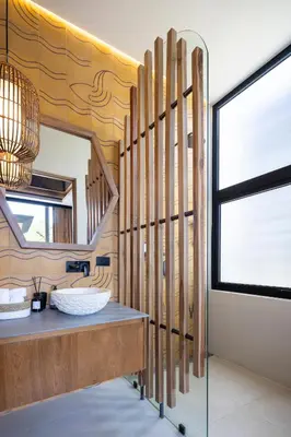 a bathroom with a sink and a mirror at QUIN Surf Residence Nosara in Nosara