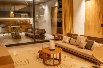 a living room with a couch and a table at QUIN Surf Residence Nosara in Nosara
