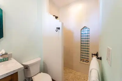 a bathroom with a toilet and a shower at Casa De Los Sueños- 5 Bedroom Home At Las Catalinas in Playa Danta