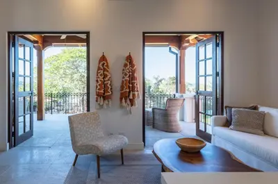 a living room with a couch and a chair at 4 Bedroom Complex At Las Catalinas in Playa Danta