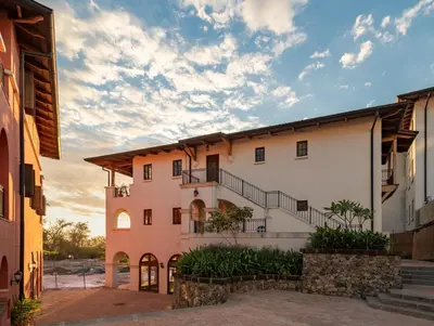 an exterior view of a building with a staircase at 4 Bedroom Complex At Las Catalinas in Playa Danta