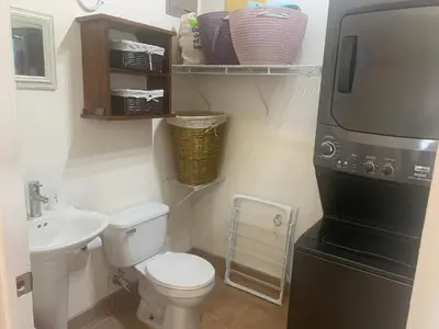a small bathroom with a toilet and a sink at Buena Vista Coco in Coco