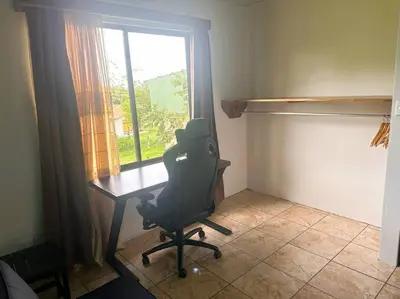 a desk with a chair in a room with a window at 2nd floor A/C, Wifi, Fully equipped apartment in Fortuna