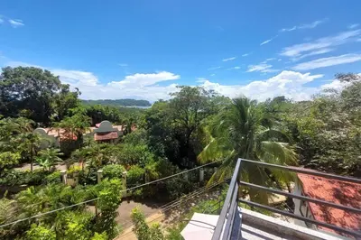 a view of the jungle from the balcony of a resort at Sunset Villa - Stunning Poolside in Sámara