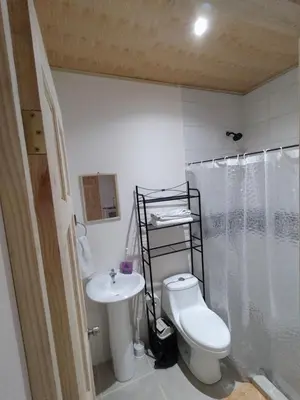 a bathroom with a toilet and a sink and a shower at Apartamento la paz N°2 in Liberia