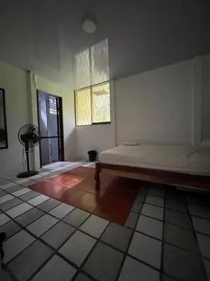 a bedroom with a bed in a room with a window at La Quinta de Ita in Morales