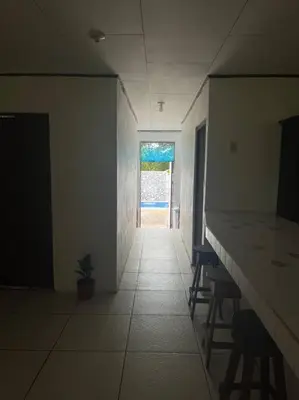 an empty room with a hallway with a table and chairs at La Quinta de Ita in Morales