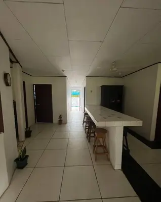 a hallway with a table and chairs in a room at La Quinta de Ita in Morales