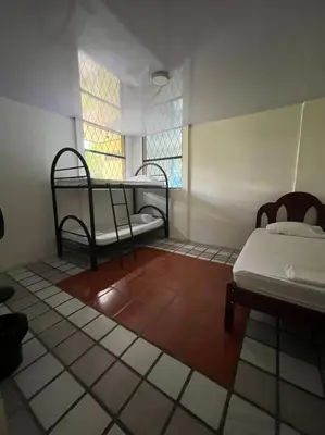 a room with two beds and a window at La Quinta de Ita in Morales