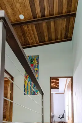 a room with a wooden ceiling and a mirror at Cloud Forest House Monteverdes in Monteverde Costa Rica