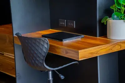 a desk with a laptop and a chair on it at Danta Santa Lofts in Fortuna