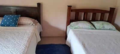 two beds sitting next to each other in a bedroom at Paradise Rio Celeste 2 in Bijagua