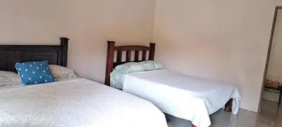 a bedroom with two beds in a room at Paradise Rio Celeste 2 in Bijagua