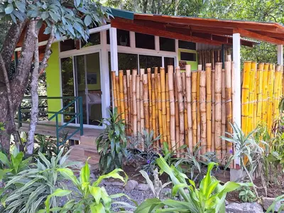 a small house with a fence in front of it at Casita Maripier Colón in Morado
