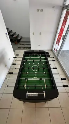 a pool table on the floor in a room at SJO Oasis Hostel in San José