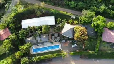 an aerial view of a house with a swimming pool at Hotel Vista Bonita in Parrita