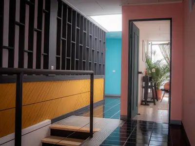 a hallway with a staircase leading to a room at Lolas Hostal Hab Individual 6 - 8 Baño compartido in San José
