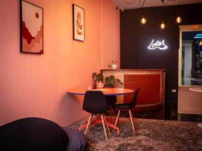 a dining room with a table and two chairs at Lolas Hostal Hab. doble (baño privado) in San José