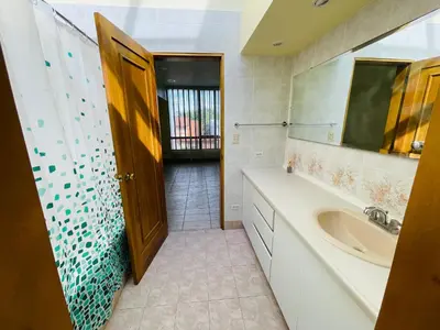 a bathroom with a sink and a mirror at The Rainier Bed & Breakfast 5 in San José
