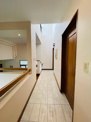 a hallway with a door and a tile floor at The Rainier Bed & Breakfast 5 in San José