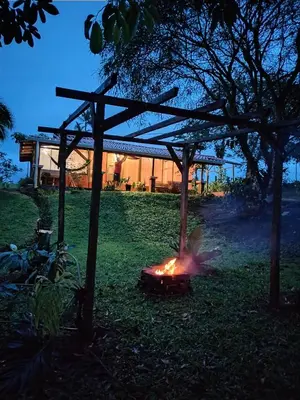 a fire in a grill in a yard at night at Cabaña Campo Verde in Marsella