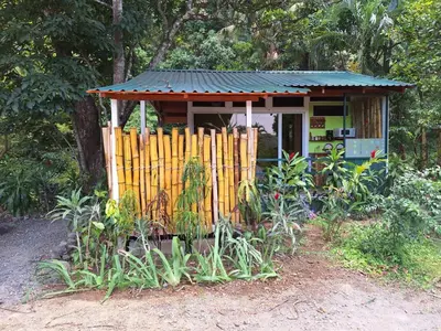 a small house with a fence in front of it at Casita Maripier in Morado