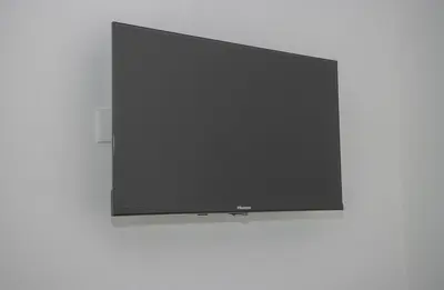 a flat screen tv hanging on a wall at The Stay San Jose in San José