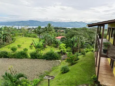 a view from the balcony of a house at Hotel Aurora Inn, Nuevo Arenal in Nuevo Arenal