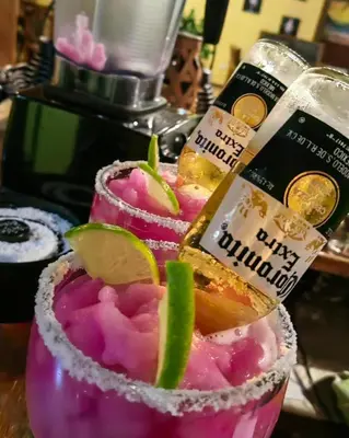 a couple of drinks with lime slices on top at Hotel Aurora Inn, Nuevo Arenal in Nuevo Arenal