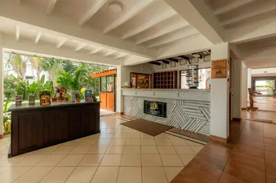 a large kitchen with a fireplace in a room at Jaco Laguna Resort & Beach Club in Jacó