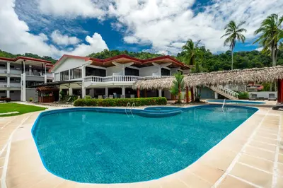 a view of a resort with a large swimming pool at Jaco Laguna Resort & Beach Club in Jacó