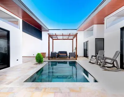 a swimming pool in the middle of a house at Casa Coral - great location - high speed internet in Uvita