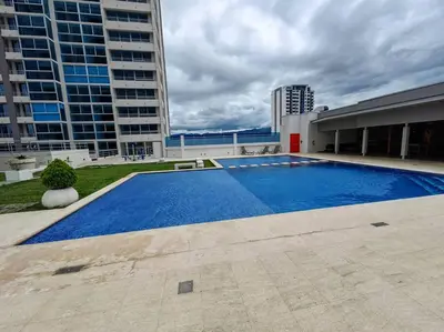 a large swimming pool in the middle of a building at 1001 Torres Los Yoses Apartamento con A/C y parqueo full equipado in San José