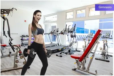 a woman in a gym with cardio equipment at 1505 Torre los Yoses Hermoso Apartamento en Barrio Escalante con Parqueo in San José