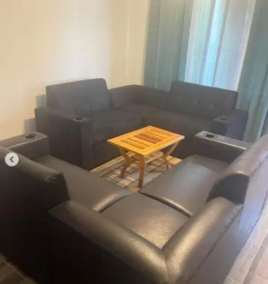 a living room with a couch and a table at Sky Hostel in Fortuna