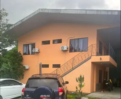 a car parked in front of a building at Sky Hostel in Fortuna