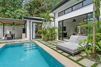 a swimming pool in the backyard of a house at Modern Garden Villa with Private Pool, Outdoor Kitchen & Separate Casita Near Playa Potrero in Potrero
