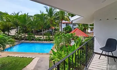 a view of the pool from the balcony of a house at 2-BD Unit with Pool 2 Blocks from Beach in Coco