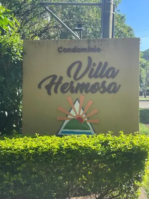 a sign for a villa heinemann at Villa Hermosa in Playa Hermosa