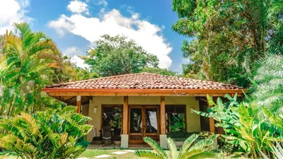 a small house with a tiled roof at Playa Cielo Beachfront Hotel - Santa Teresa, Costa Rica in Santa Teresa Beach