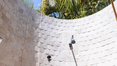 a brick wall with a light on top of it at Playa Cielo Beachfront Hotel - Santa Teresa, Costa Rica in Santa Teresa Beach